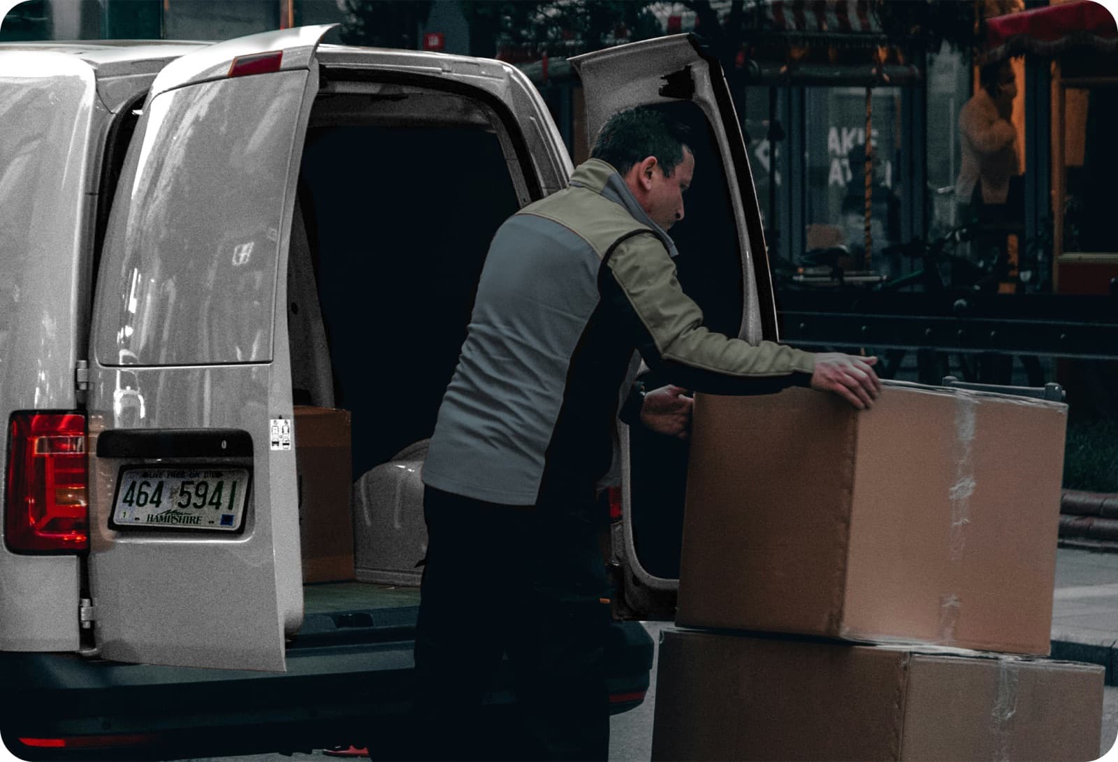 Curri driver loading cargo onto a pickup truck bed — scaling delivery capacity for distributors without adding trucks or headcount