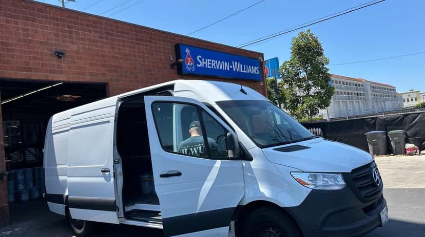 White Mercedes-Benz Sprinter Van at a Sherwin-Williams paint counter for a Curri same-day pickup