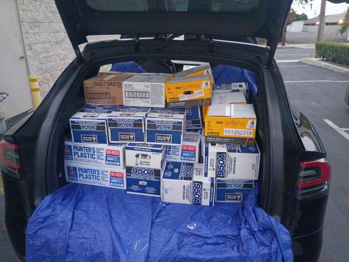 Curri SUV with the trunk loaded full of Sherwin-Williams paint boxes ready for a same-day supply delivery